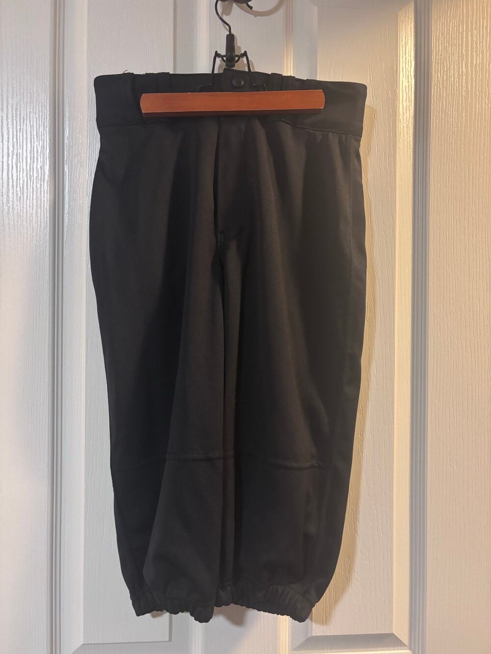 Knee length black baseball pants